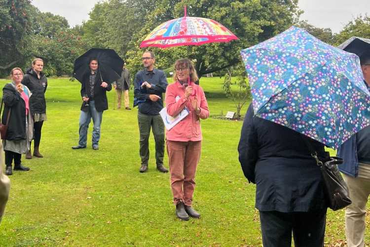 The Garden Manager, Jenny Bell Harman, on her informative tour round the garden, in the rain.