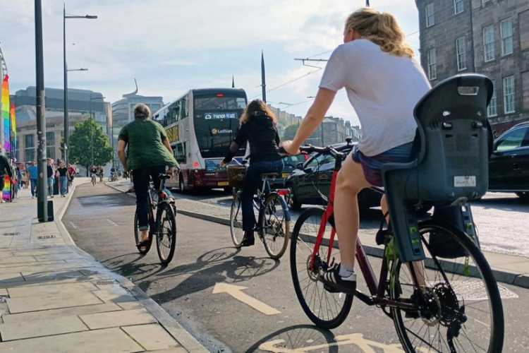 People cycling on Leith Walk in Edinburgh